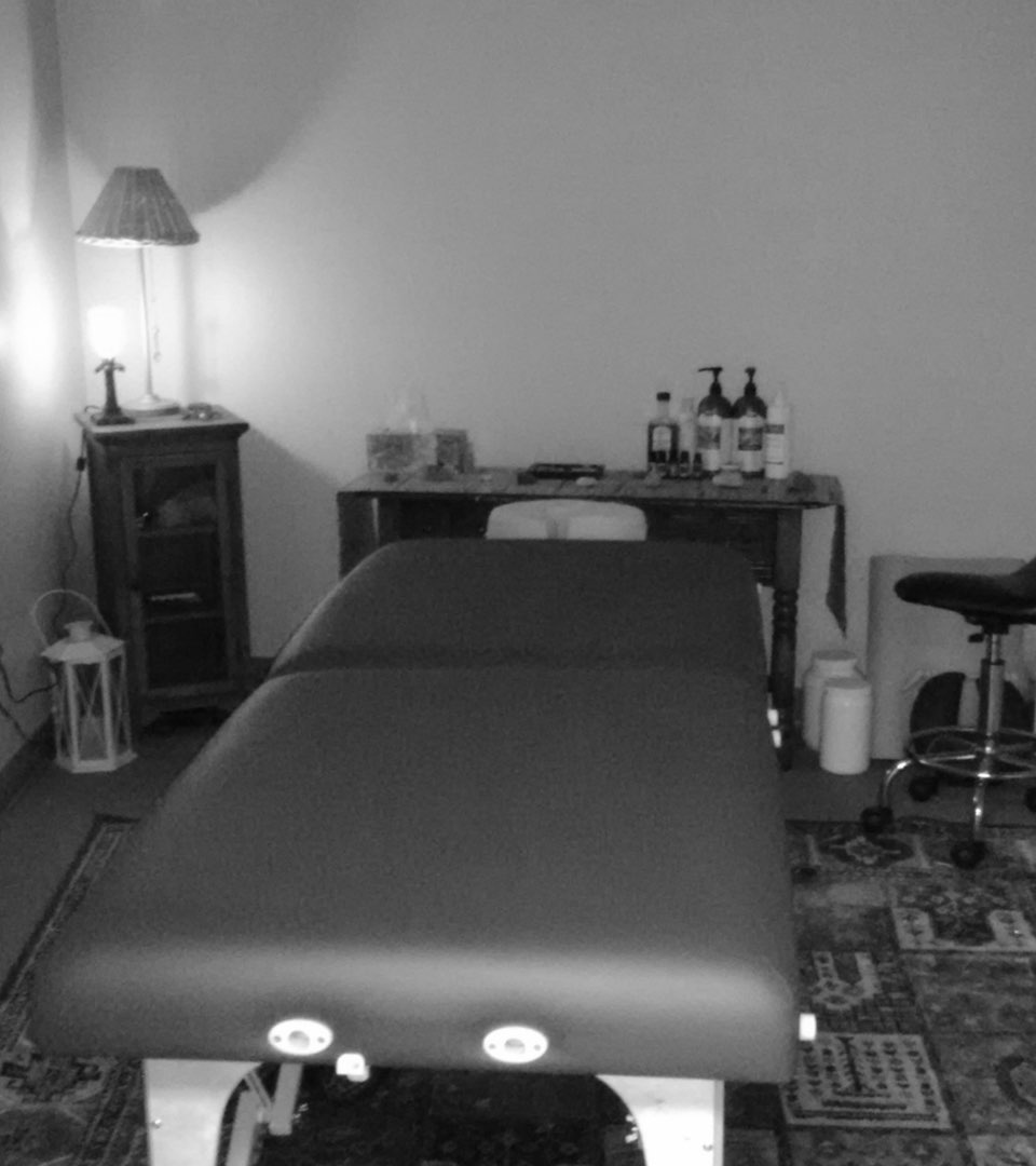 Black and white photo of massage treatment room at Advanced Health Massage and Yoga